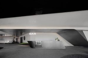 深圳福田卓越城現代風格辦公室裝修設計前廳吧臺洽談區(qū)效果圖