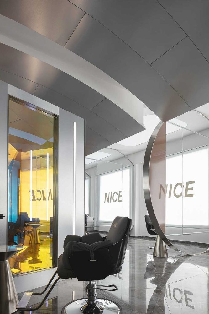 發(fā)型工作室沙龍中心大理石地板裝修設(shè)計黃色墻體玻璃隔斷