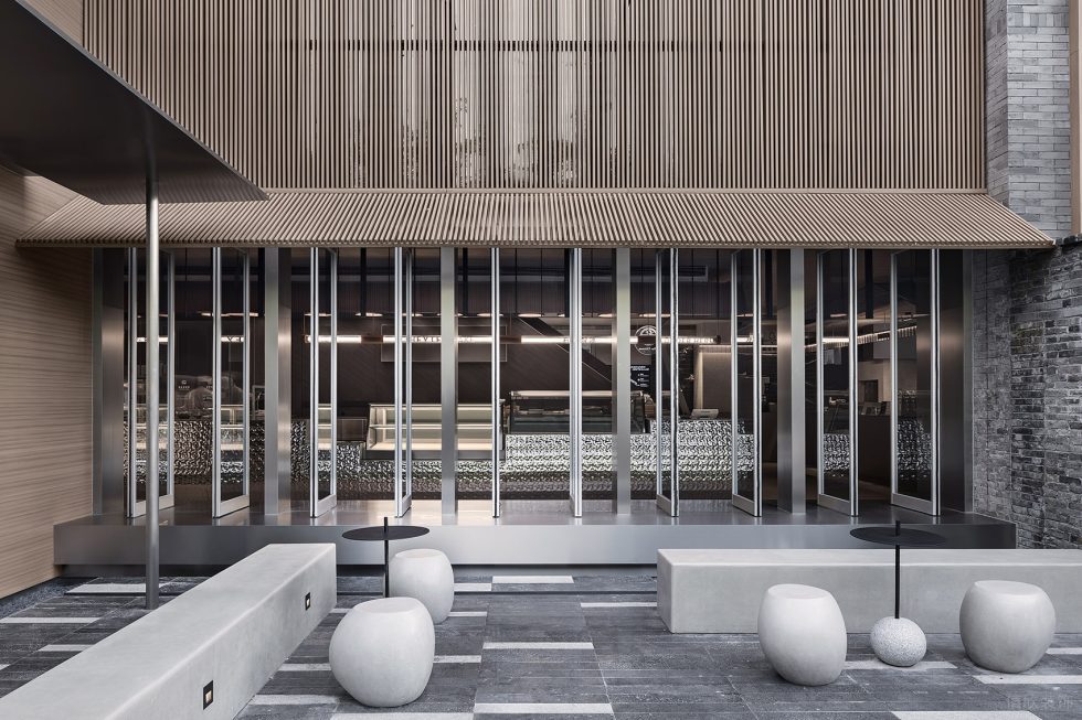 現(xiàn)代風飲品店不銹鋼玻璃門裝修設(shè)計